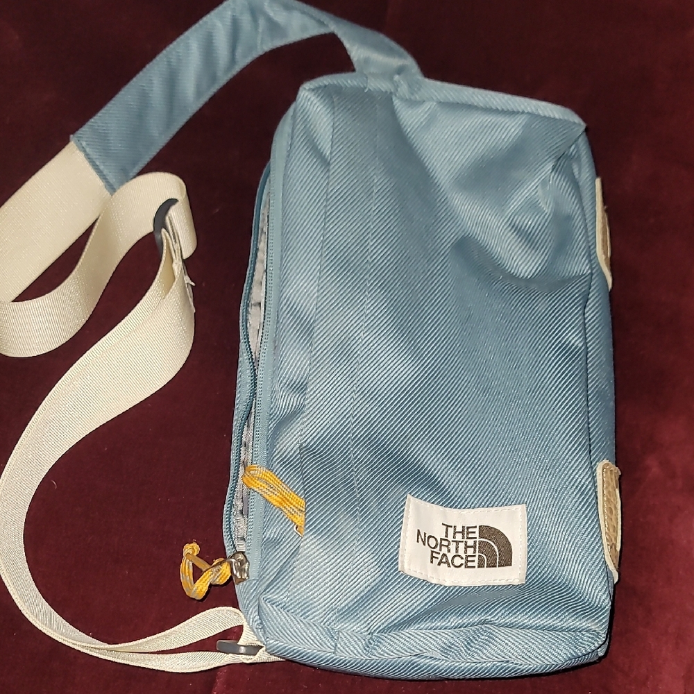 The North Face Blue and White Belt Bag with Durable Canvas